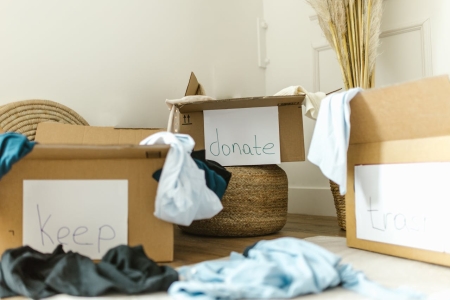 Organizing Home Goods & Clothes in piles to Keep, Donate, or Throw Out